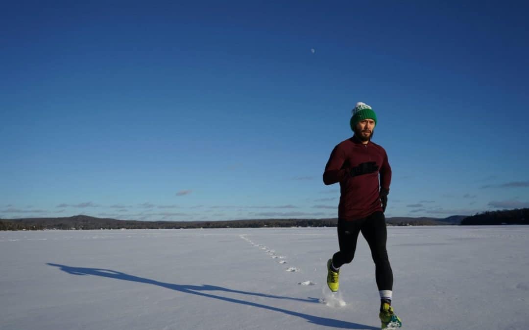 man running on ice covered land