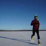 man running on ice covered land