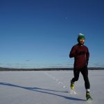 man running on ice covered land