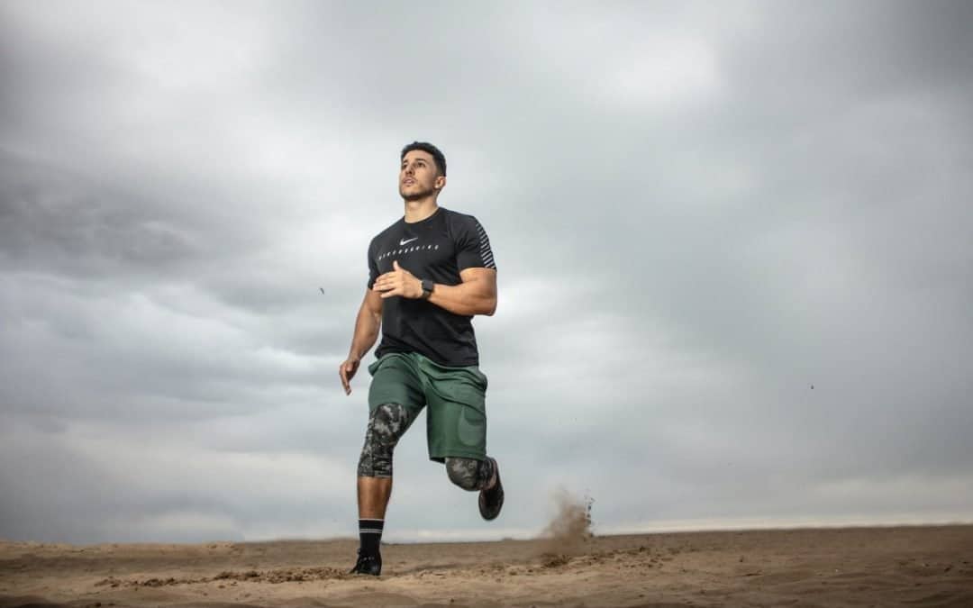 man running on sand field