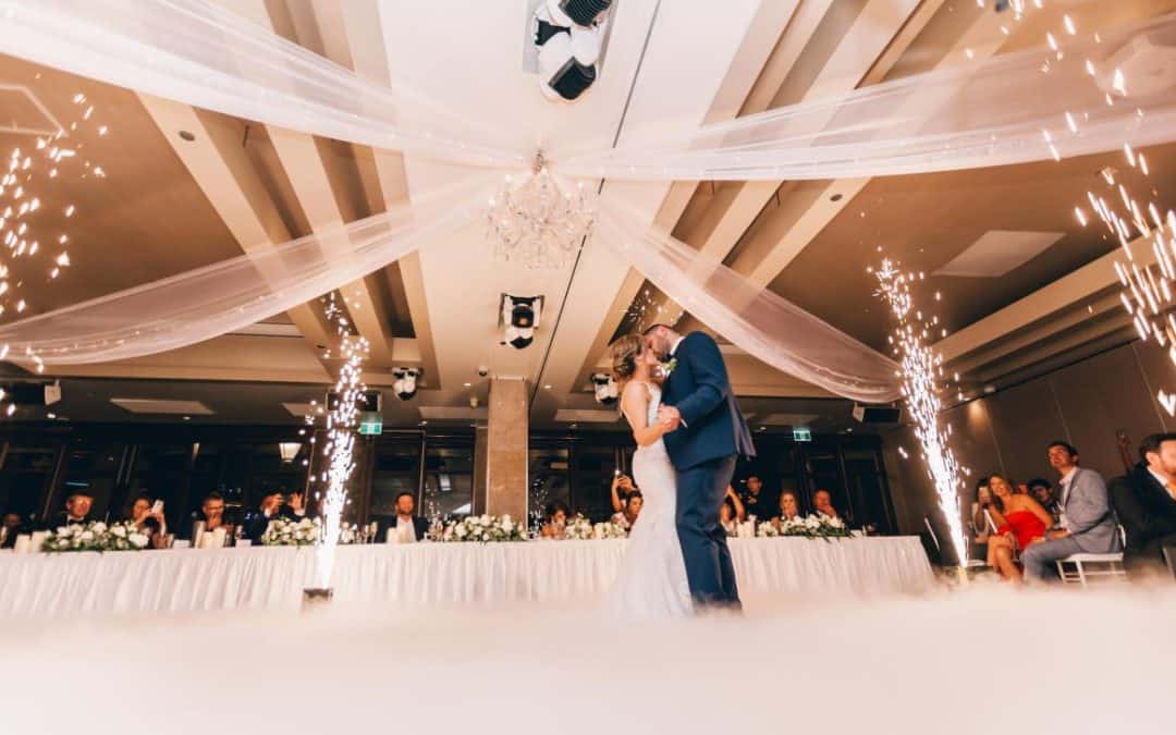 low angle photography of bride and groom dancing