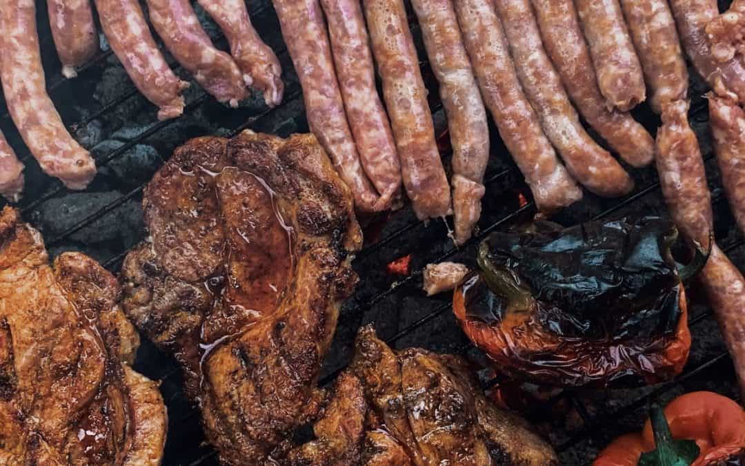 roasting meat and sausages on barbecue grid