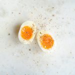 spiced soft boiled egg on marble tabletop