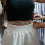 photo of person measuring woman s waist