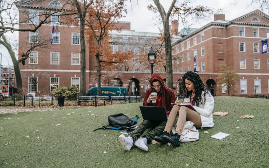 man and woman studying at a park