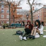 man and woman studying at a park