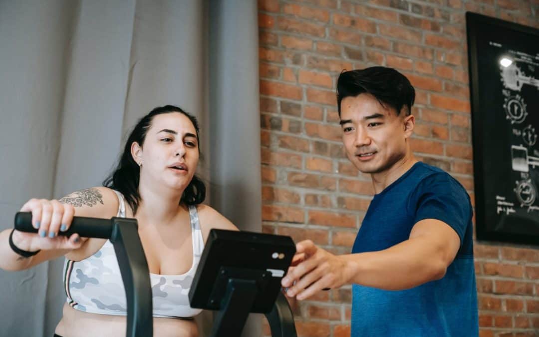 a woman and her personal trainer