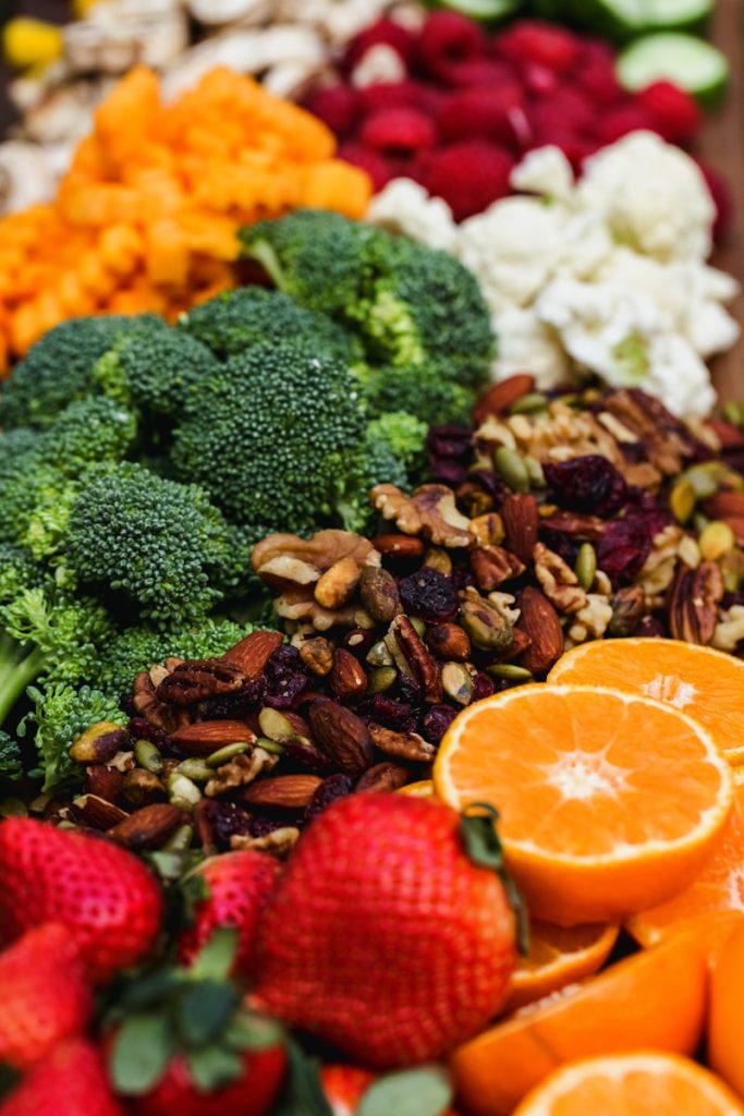 Nutrition - sliced orange fruit and green broccoli